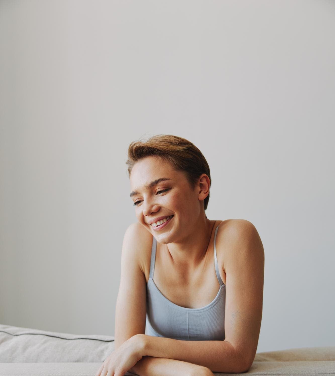 Smiling young woman with short hair