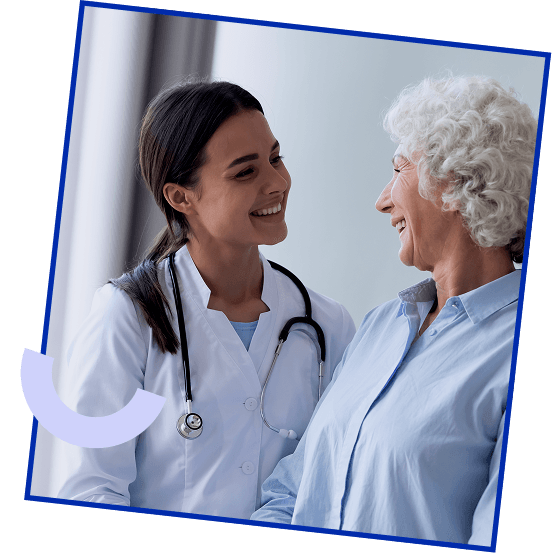Smiling physician with an older patient